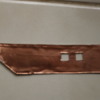 Copper sheet backing on loading trunk rivit side