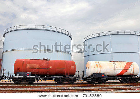 stock-photo--train-wagons-and-oil-and-fuel-storage-tanks-79182889