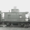 C587b: Prototype B&amp;O K-1 photographed at St. George with an M of W tool car in 1942.