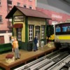 Trackside scene Light Rail picks up passengers at station