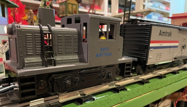 Lionel 18912 Amtrak Industrial Switcher close up with express car