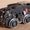 2012-1643-mystery-chassis-2: The second and third photos show the mechanism linkage on the side of the motor, from the drive gear to the reversing switch.