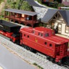 Coal dump car and caboose: Part of our freight consist