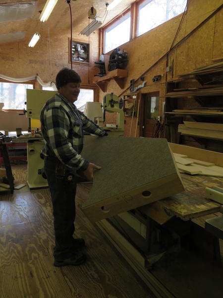 Straightforward Layout, Ray lifting platform off table in carpentry shop