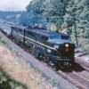 image: Here's a pic of some single stripe PA's pulling a passenger train in the 60's
