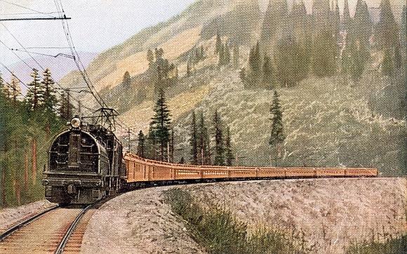 Transcontinental train Olympian in the Cascades hauled by GE gearless loco CM&St P Rwy