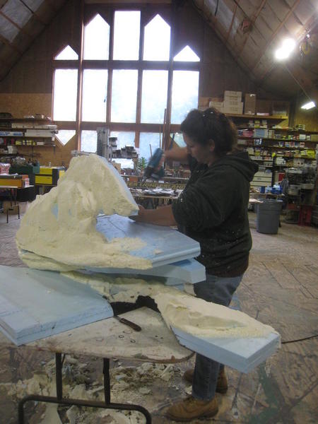 Delia separating pieces of mountain to carve them