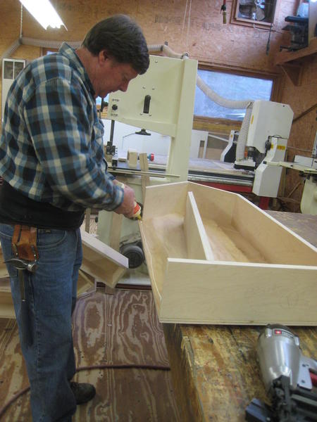 Ray glues before nailing in last piece on platform.