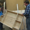 Bob &amp; Ray carrying platform from carpentry shop