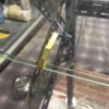 Glass top station: close up of upper glass support, brass