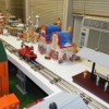 Upper Level, South Wall 1 - LR: The MTH Santa Handcar running along the south wall of the upper level of the layout.