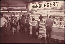 220px-HAMBURGER_STAND_OFFERS_CUSTOMERS_A_QUICK_BITE_WHILE_WAITING_FOR_THEIR_SUBWAY_TRAIN_ON_THE_42ND_STREET_STATION..._-_NARA_-_556816