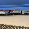 DE6D79E4-5C88-4874-932A-341FEC41CD51: Atlas P32-BW Amtrak Pepsi Can and Sunset Amfleet I Coach.
