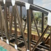 Gusset plates and lace girder installed on 3-span O scale bridge (close up)