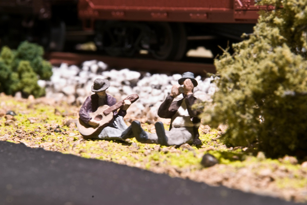 Hobos near the roadway and their beloved trains-031